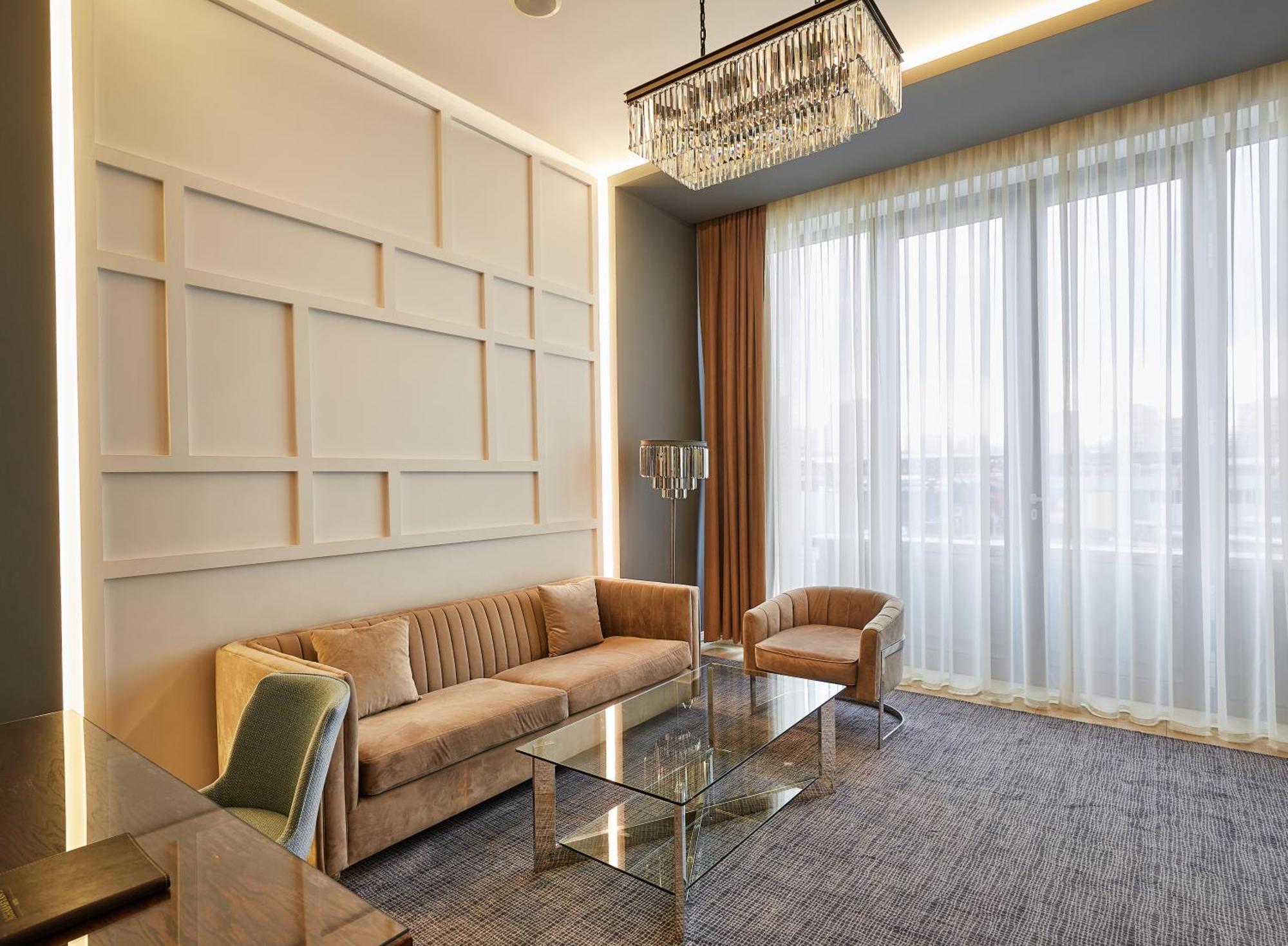 Aghababyan'S Hotel Jerevan Exteriör bild A living room in a suite at the hotel